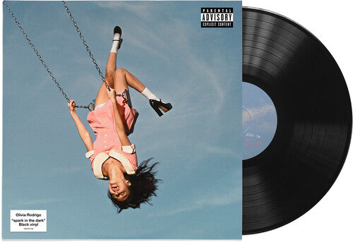 Vinyl record with a cover featuring a person on a swing against a blue sky.
